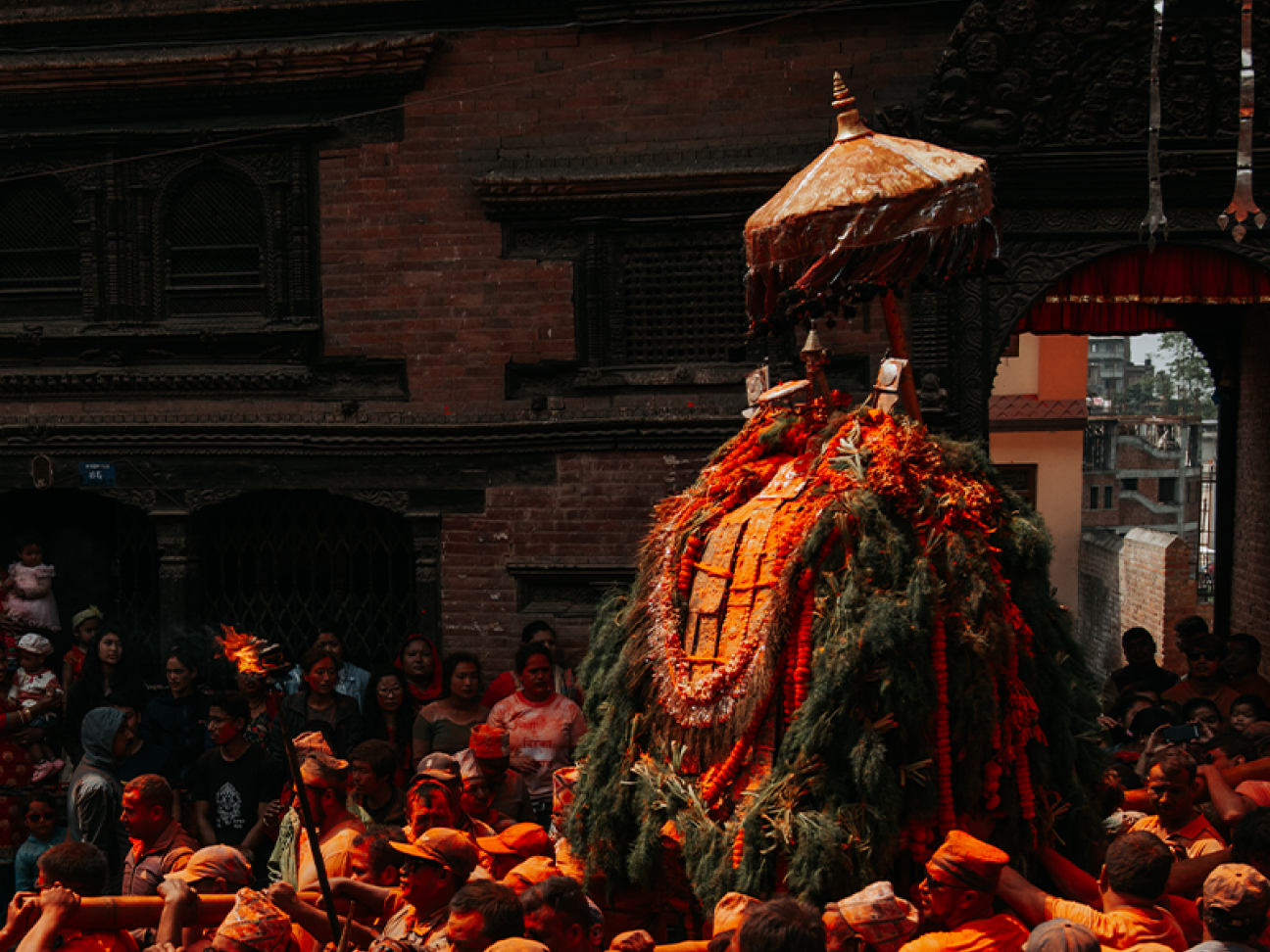 People carrying temple